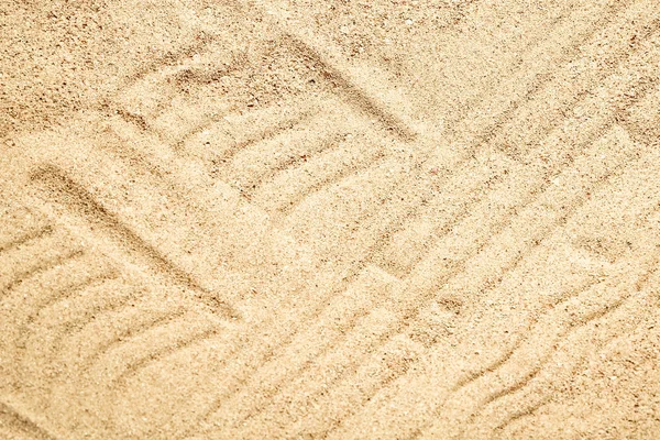 Красивий малюнок на піску морського фону — стокове фото