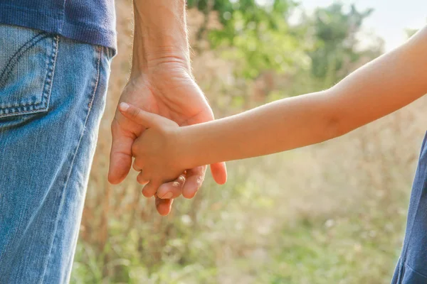 Beautiful hands outdoors in a park — Stock Photo, Image