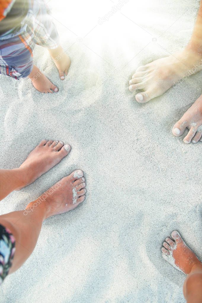 beautiful footprints with feet on the sand background