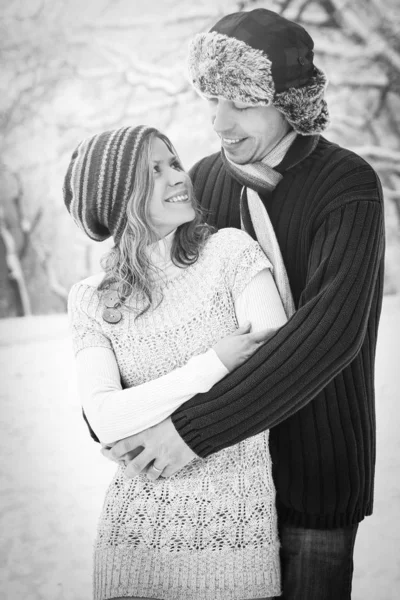 Stylish beautiful couple in winter park on a nature background — Stock Photo, Image