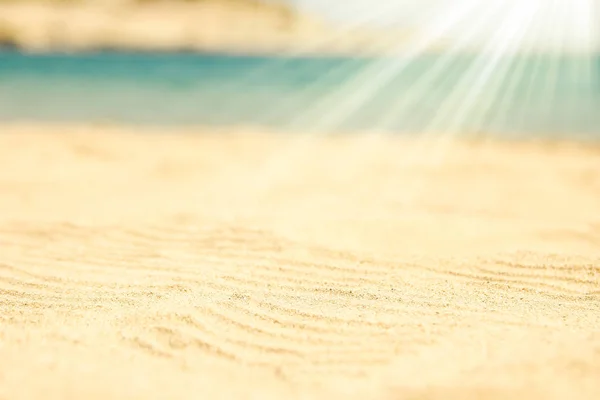 Prachtige tekening op het zand van de zee achtergrond — Stockfoto