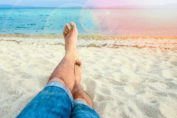 Beautiful legs in the sand of the sea greece background — Stock Photo, Image