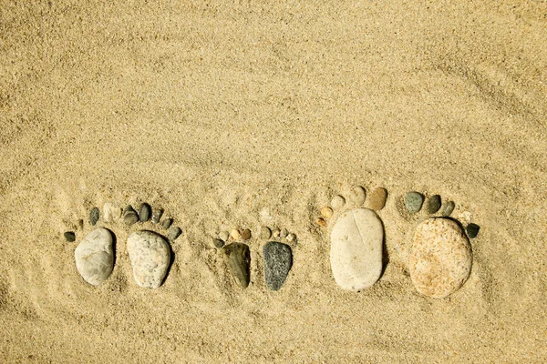 Pés de uma família de pedras no mar — Fotografia de Stock