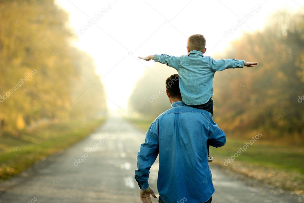 father and son walk in nature