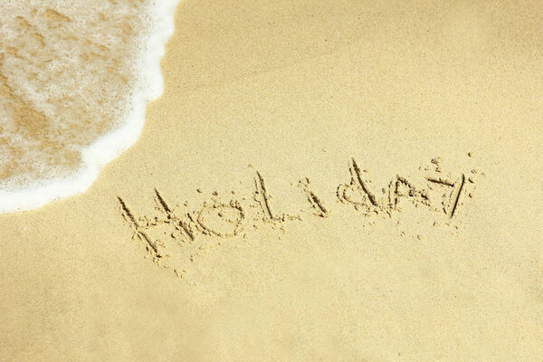 holiday inscription on the beach