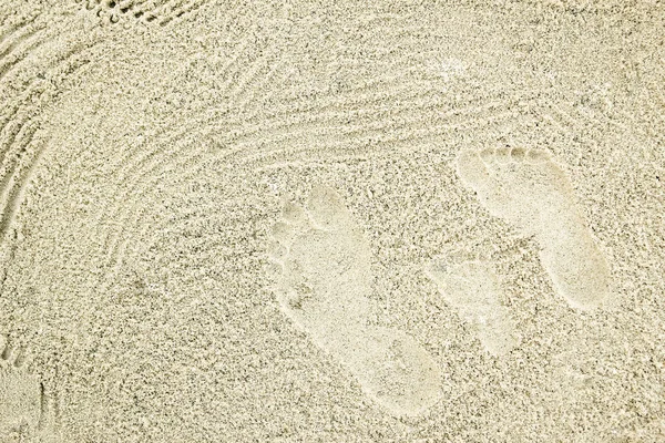 Beautiful pattern on the sea sand on nature background — Stock Photo, Image