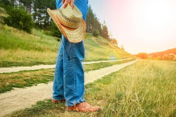 Beautiful hands of a cowboy's legs in the park on nature — Stock Photo, Image