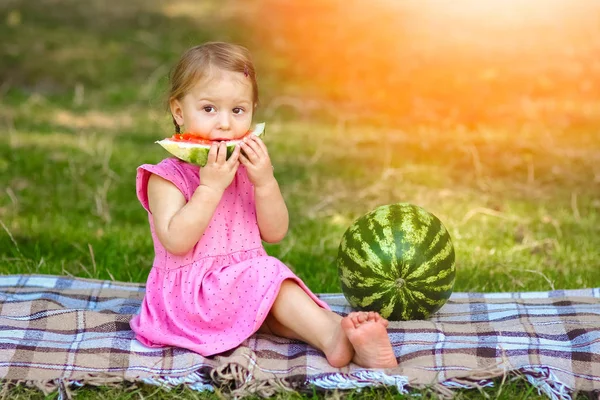 Happy child with watermelon on nature in the park — Stock Photo, Image