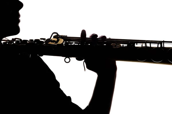 Saxafon on a white background in the hands of a musician silhoue — Stock Photo, Image
