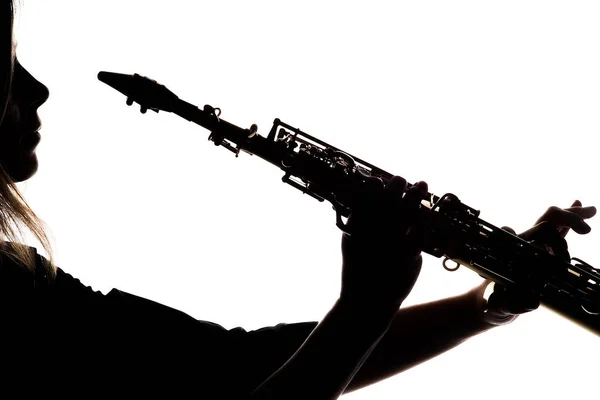 Saxafon on a white background in the hands of a musician silhoue — 스톡 사진