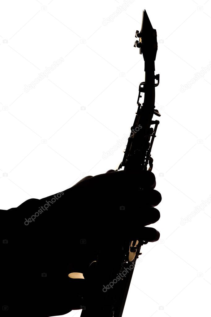 saxafon on a white background in the hands of a musician silhoue