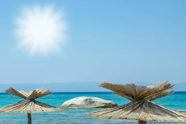 beautiful umbrellas sun loungers by the sea on nature background