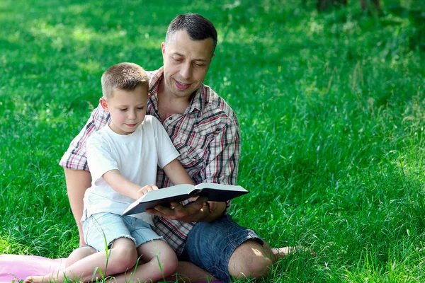 Happy Father Son Reading Bible Nature — Stock Photo, Image
