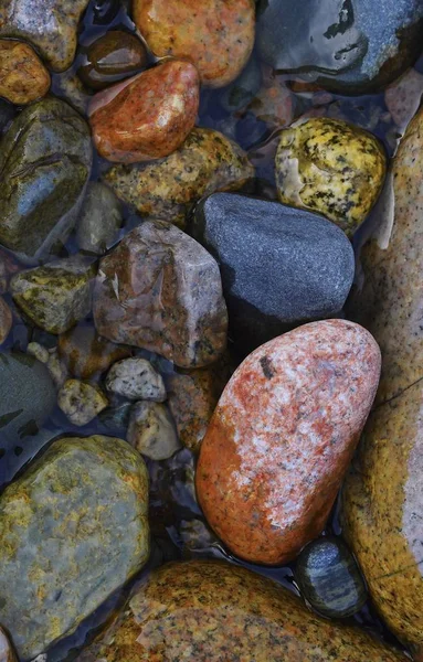 Composition of colored stones. Stones from a mountain river in the mountains of Kyrgyzstan
