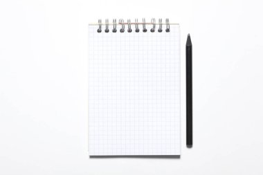 blank notepad and black pencil isolated on white background with copy space for your text