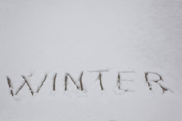 word winter written in the snow with copy space for your text