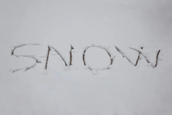 word snow written in the snow with copy space for your text