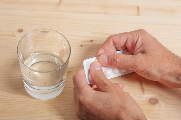 Man Hands Tablet Pills Blister Glass Water Wooden Table Copy Stock Picture