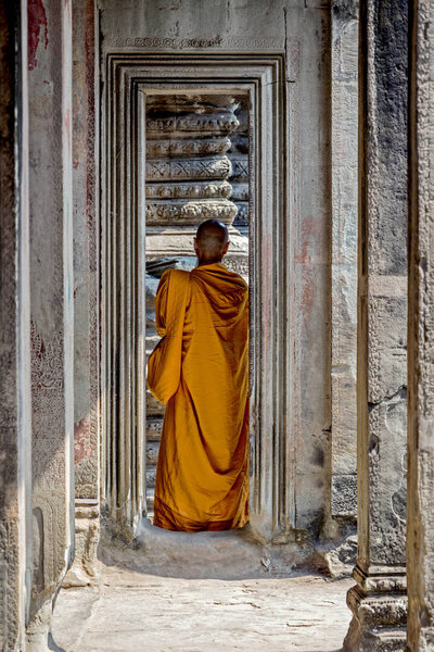 monk in temple at angkor wat