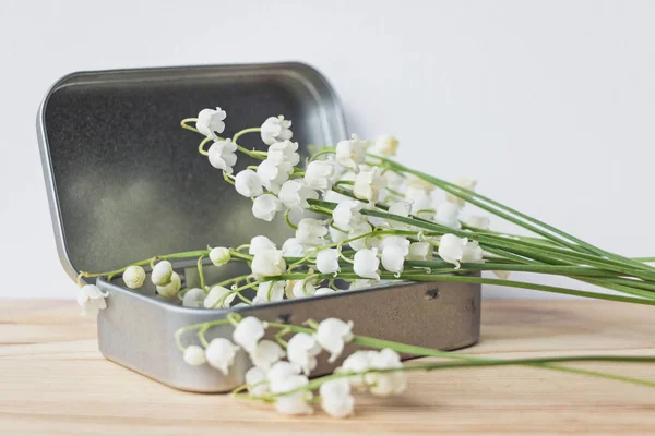 lily of valley flowers bouquet in metal box