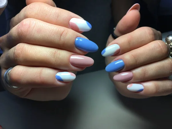 gentle manicure in blue and pink in the form of an oval