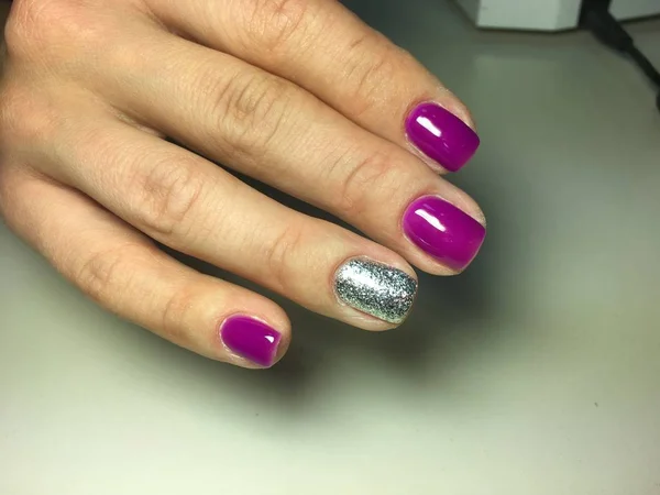 fashionable manicure of fuchsia with silver design on short nails