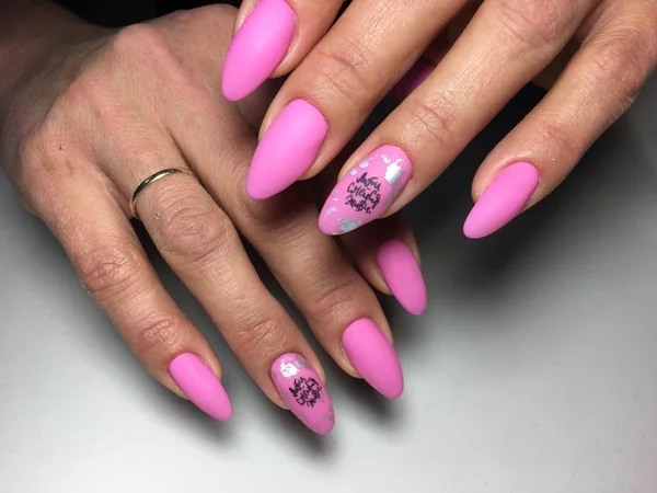 bright pink manicure with fashionable design on long nails