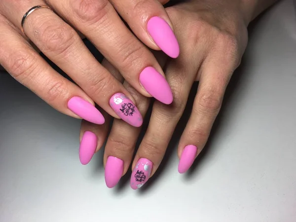 bright pink manicure with fashionable design on long nails