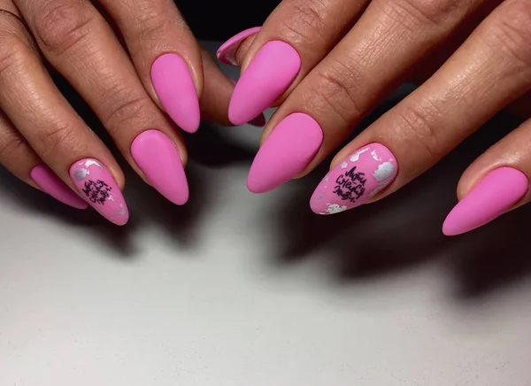 bright pink manicure with fashionable design on long nails