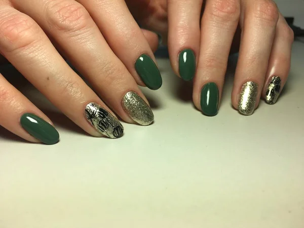 trendy green manicure on a textural
