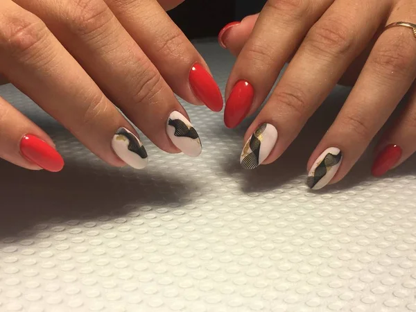 Trendy red manicure with black lace design — Stock Photo, Image