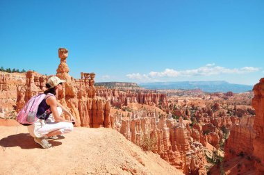 girl look out on the Bryce Canyon clipart