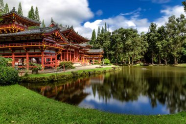 Byodo-in japanese temple with a pond in front, Oahu island, Hawaii clipart