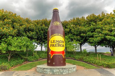 PAEROA, NEW ZEALAND - DECEMBER, 2017: Lemon and Paeroa famous beverage bottle statue clipart