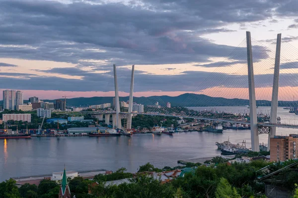 Golden bridge and Golden Horn bay at sunset, Vladivostok, Russia