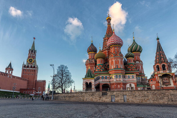 Tourists walking near Kremlin and St Basil's Cathedral in Moscow