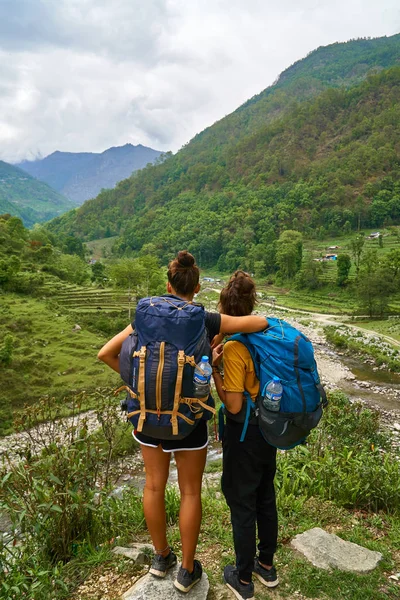 friends enjoying a break from hiking in Nepal Annapurna region