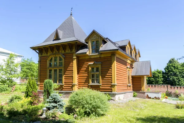 Summer wooden house made of logs. Summer courtyard