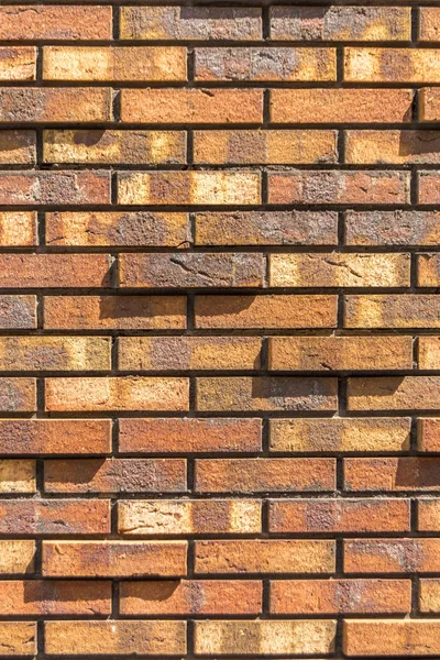 Red brick wall. Decorative brick with artificial defects and cracks. Background texture