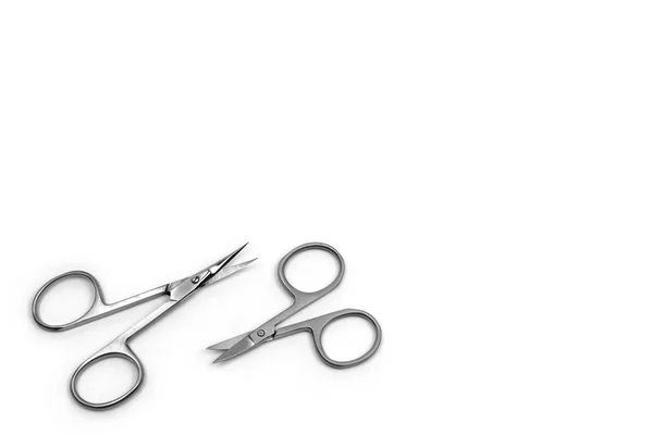 Nail Clippers for nail and cuticle care. Two scissors of different size on white background.