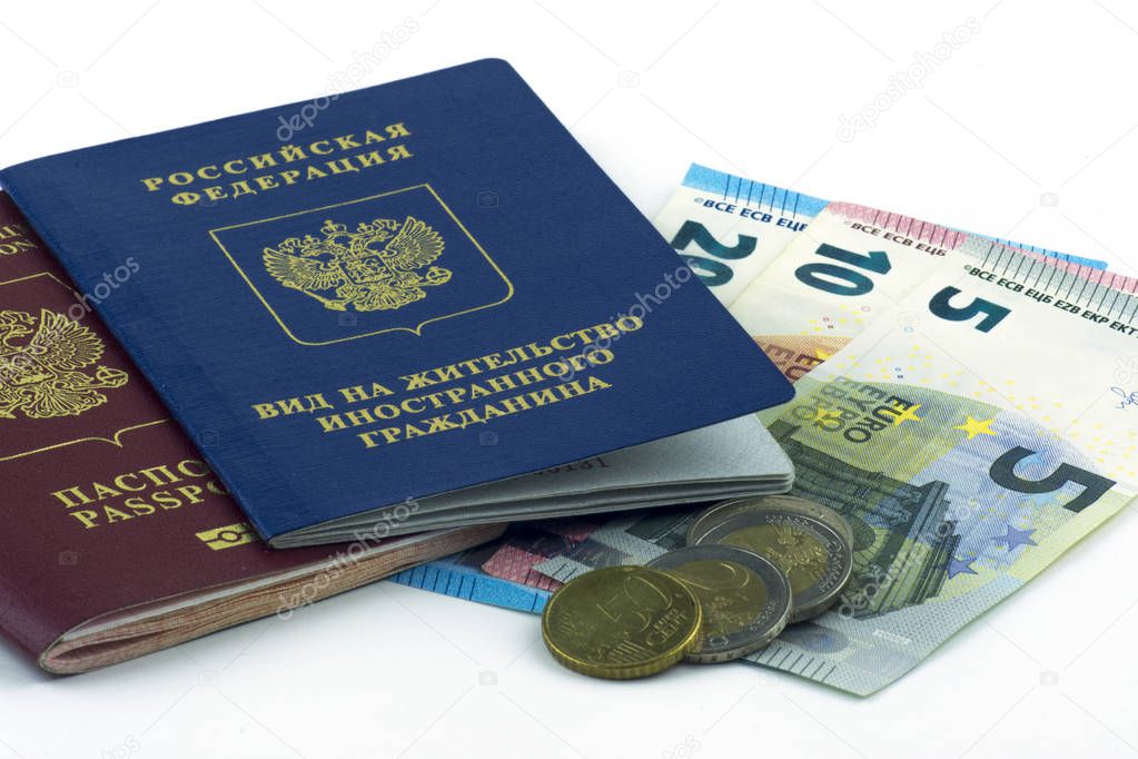 Russian documents. Residence permit and russian passport. Cash Euro banknotes on white background. Close up