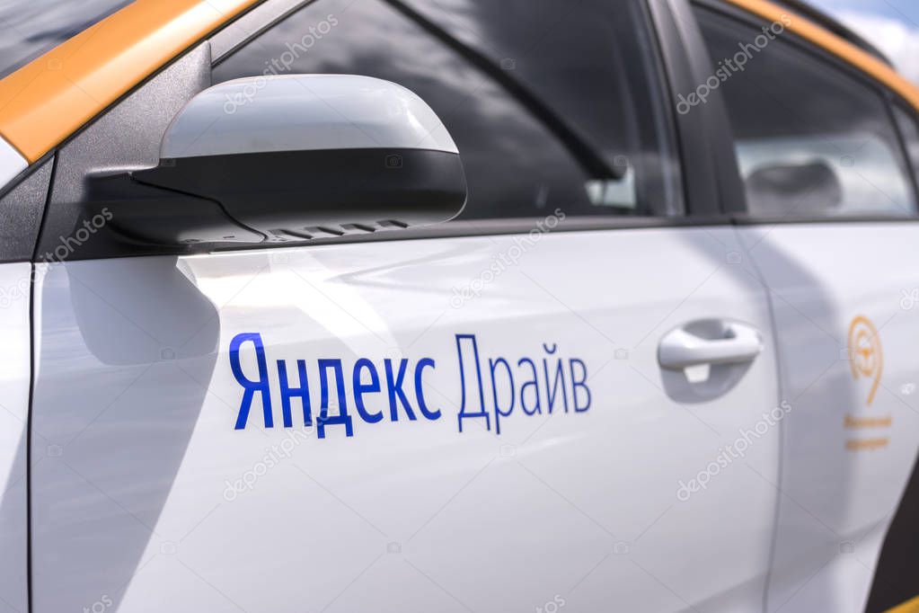Moscow, Russia, 30 July 2019. Yandex Drive - Russian car sharing car in Moscow. Close-up focus on the first letter.