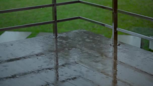 The rain falls on the tile on the terrace. — Stock Footage The rain falls on the tile on the terrace. Royalty Free Stock Video