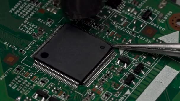 Heating Microchip Contacts Electronic Printed Circuit Board Using Soldering Station — Stock Video