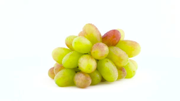 A bunch of white grapes with water drops. Slowly rotating on the turntable. Isolated on the white background. Close-up. Macro. — Stock Video