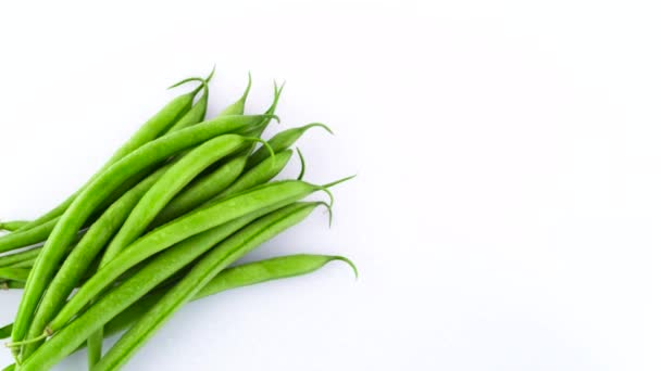 Top View Green Beans Pile Rotating Turntable Isolated White Background — Stock Video