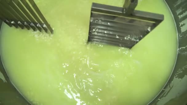 Automatic mixing of fermenting milk inside large industrial stainless steel tank. Curd preparation. Cheese production equipment. — Stock Video