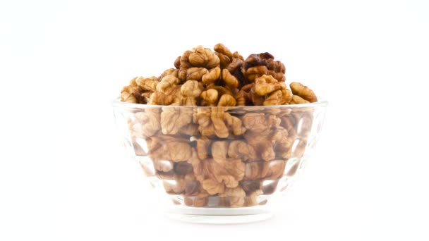 Heap Walnuts Glass Bowl Rotating Turntable Isolated White Background Close — Stock Video