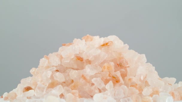 Himalayan Pink Salt Crystals Rotating Turntable Isolated Grey Background Close — Stock Video