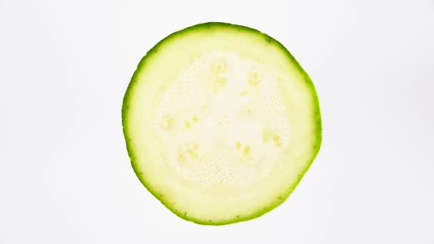 Top View Courgette Cross Section Cut Rotating Isolated White Background — Stock Video